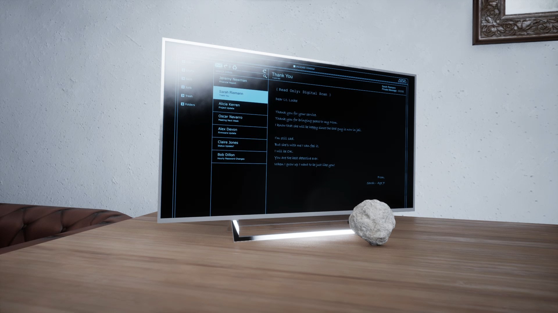 The rock on a table in front of a TV