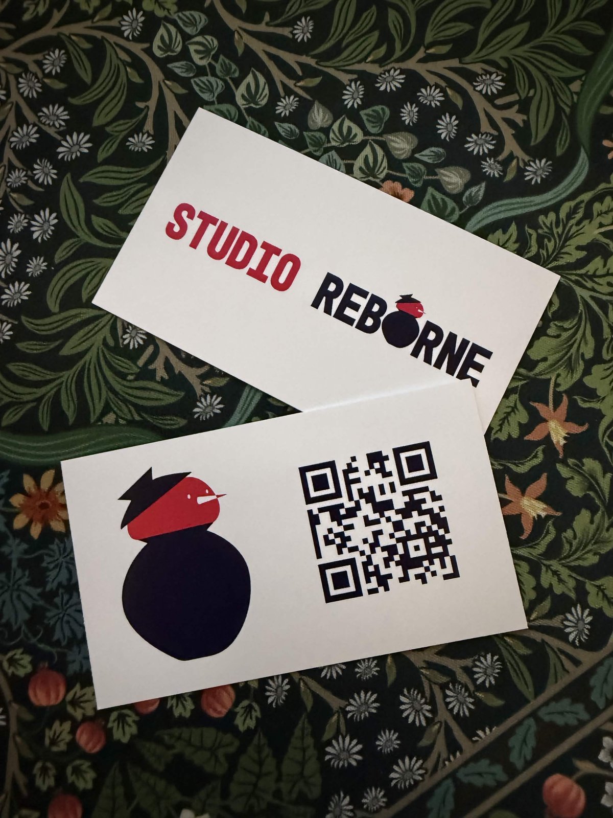 Studio Reborne business cards: logo on the front, mascot and QR code on the back
